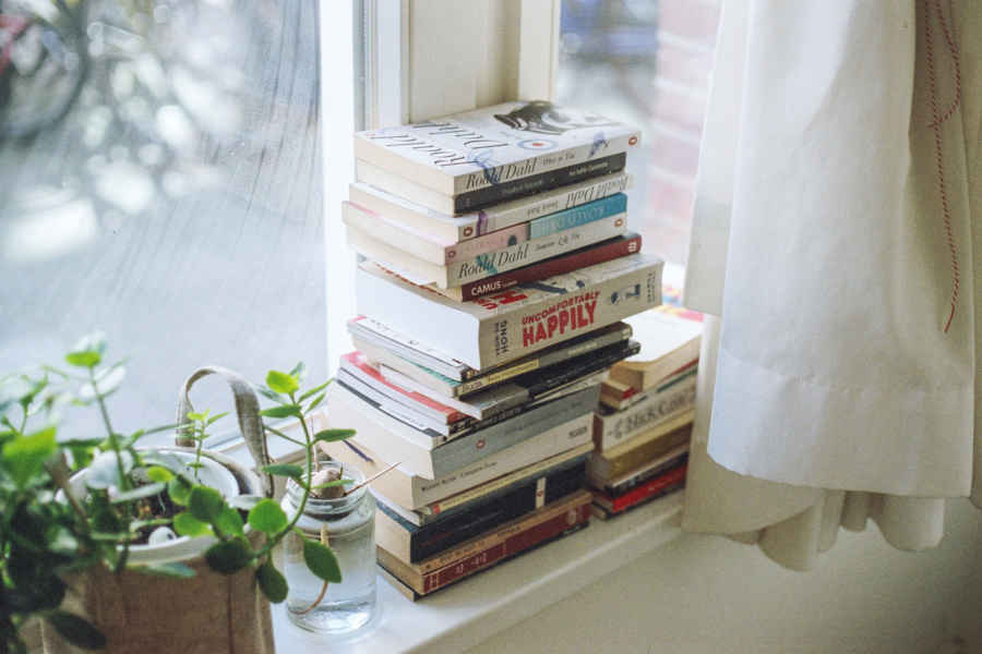 pile of books and dvds