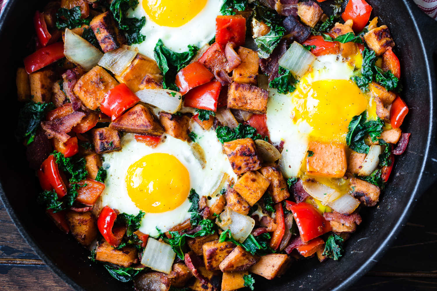 Easy tomato, chorizo and sweet potato hash with baked eggs - Rest Less