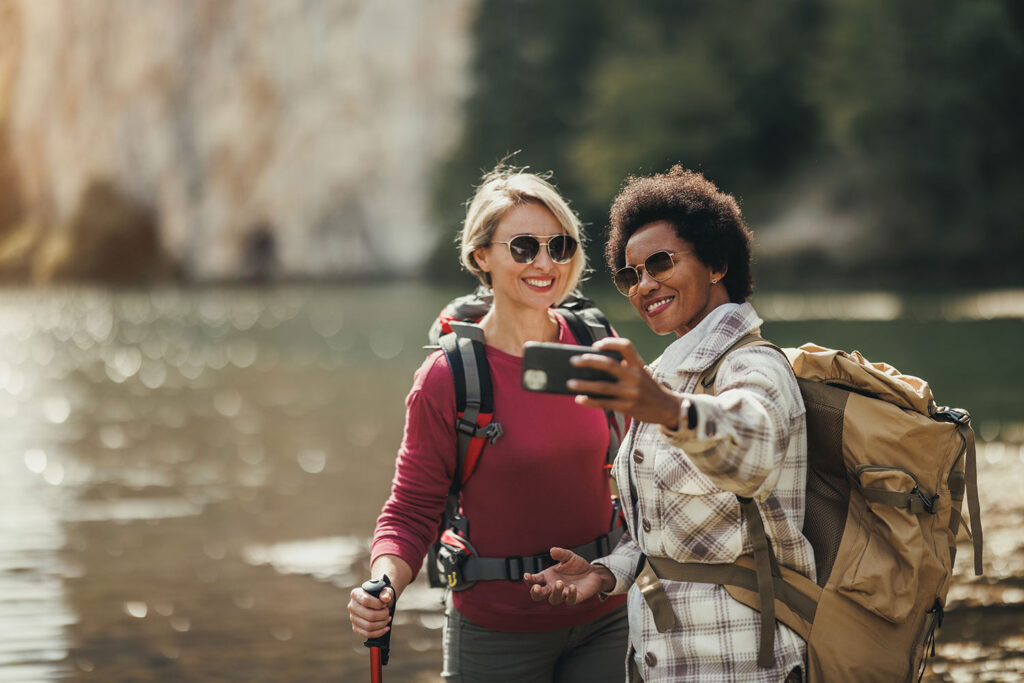 Couple enjoying recreational activity outdoors – fulfilling one of the key needs of a man from a woman.