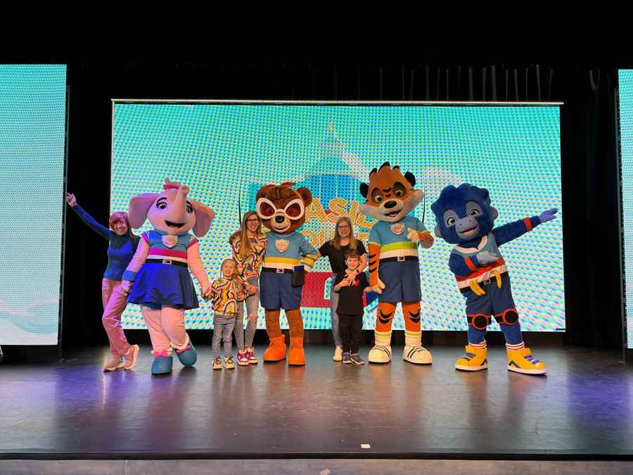 Julie and her family on stage with Haven's characters: the Seaside Squad