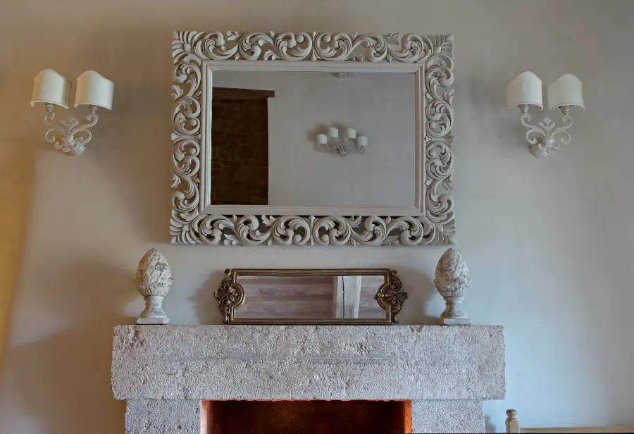 Hang a mirror over the mantelpiece