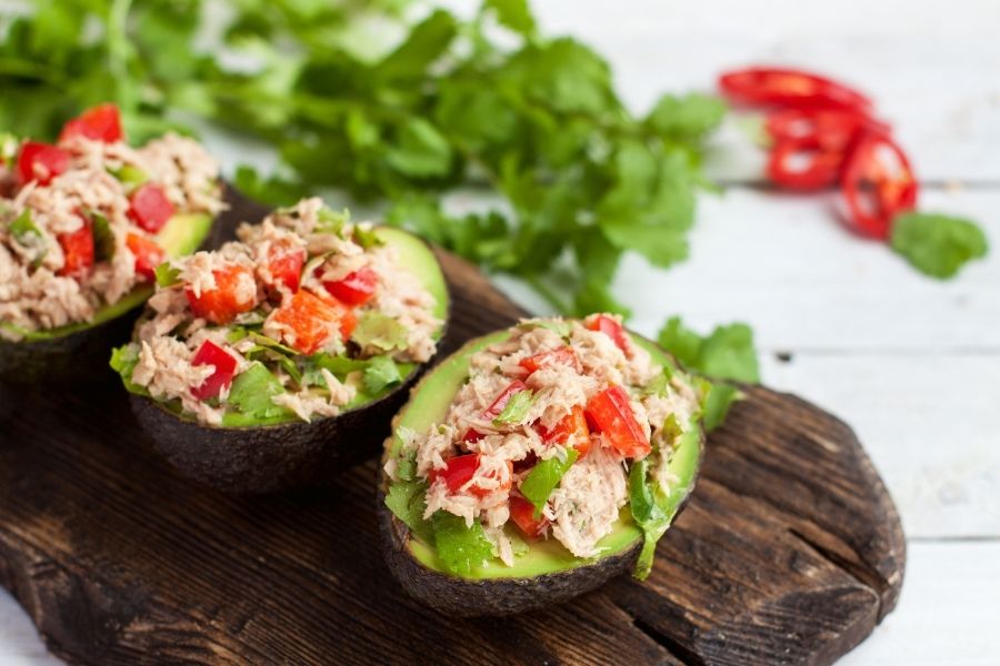 Tuna-stuffed avocado with vegetables